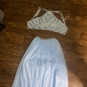 This is a blue and silver prom dress. It is a size 3.